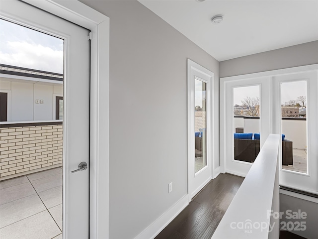 interior space featuring baseboards and wood finished floors