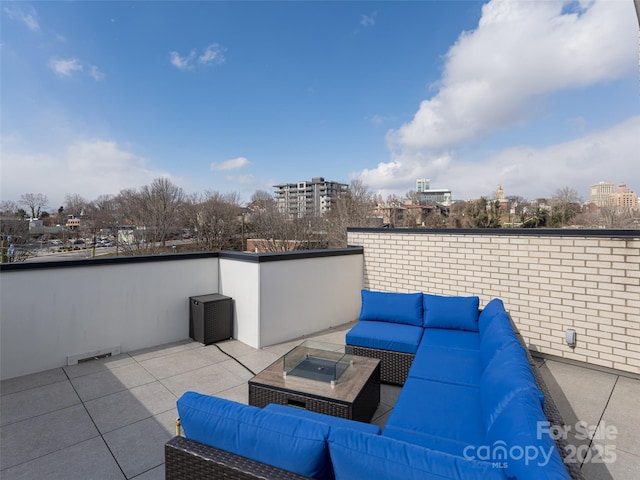 view of patio / terrace with an outdoor hangout area, a view of city, and visible vents