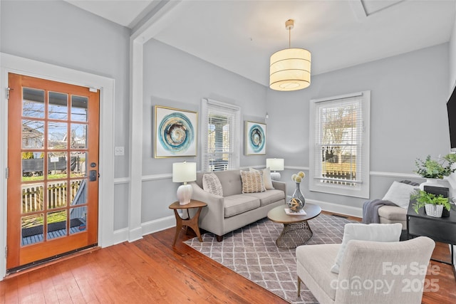 living room with hardwood / wood-style flooring and baseboards