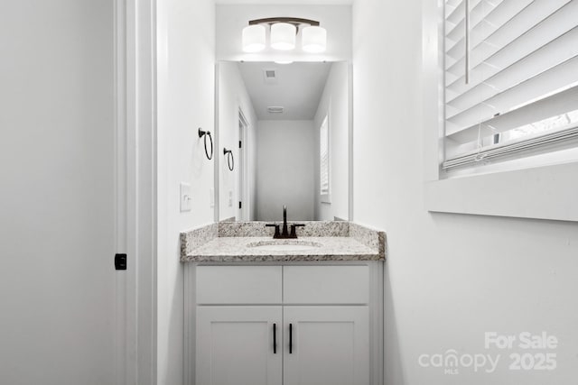 bathroom featuring visible vents and vanity