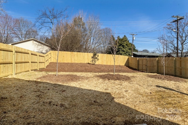 view of yard featuring a fenced backyard