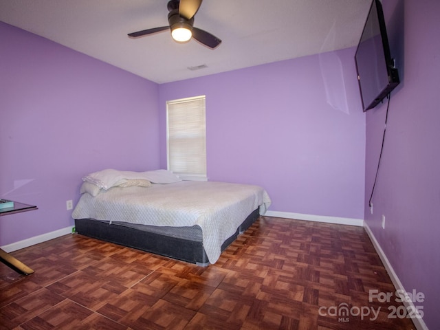 bedroom featuring visible vents, ceiling fan, and baseboards