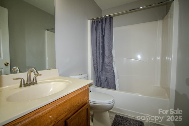 bathroom featuring toilet, shower / bath combo with shower curtain, and vanity