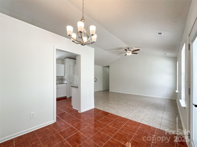 empty room with visible vents, baseboards, vaulted ceiling, and ceiling fan with notable chandelier