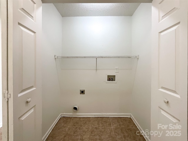 washroom with baseboards, washer hookup, laundry area, electric dryer hookup, and a textured ceiling