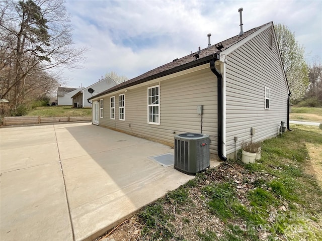 back of house featuring cooling unit and a patio