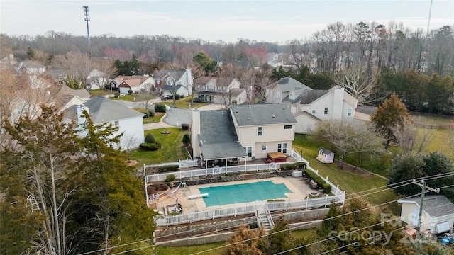 birds eye view of property with a residential view