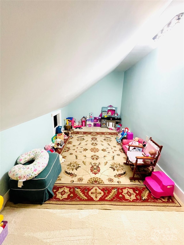 playroom with lofted ceiling