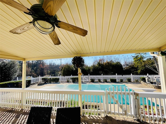 view of pool featuring a patio area, fence, and a fenced in pool