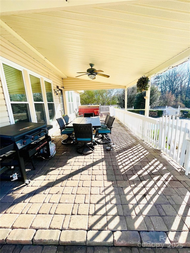 view of patio / terrace with outdoor dining space, fence, and ceiling fan