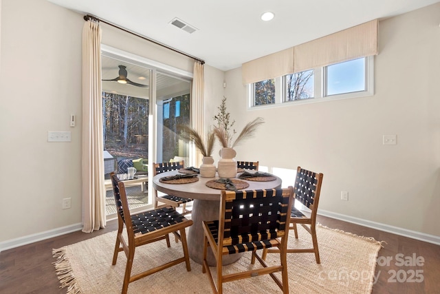 dining area with dark wood-style floors, recessed lighting, visible vents, and baseboards