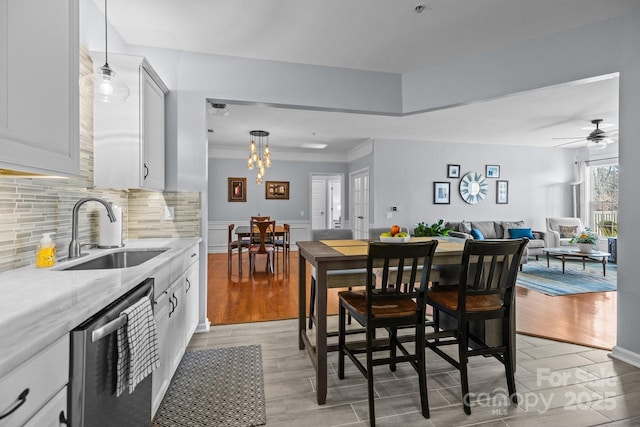 dining space featuring light wood-style floors and a chandelier