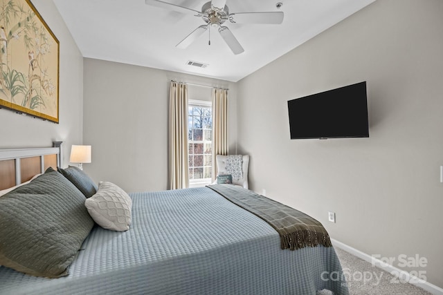 bedroom with carpet floors, baseboards, visible vents, and a ceiling fan