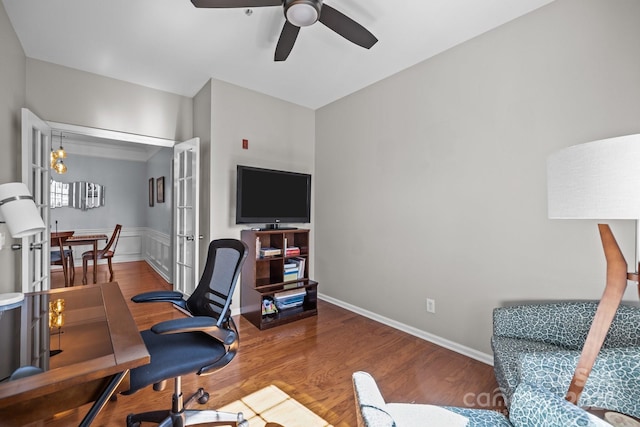 office space with ceiling fan, baseboards, and wood finished floors