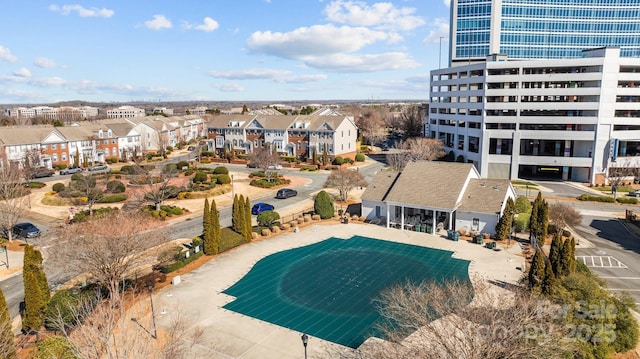 view of swimming pool with a residential view