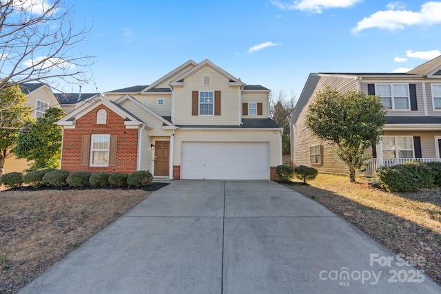 view of front of property featuring brick siding, driveway, and an attached garage