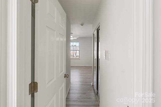 corridor with light wood-style flooring