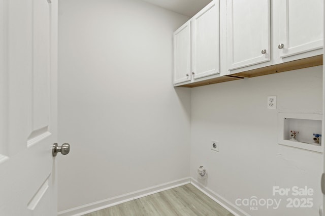 laundry room featuring washer hookup, baseboards, cabinet space, light wood finished floors, and electric dryer hookup