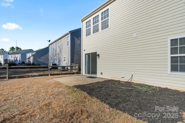 back of property featuring a patio area