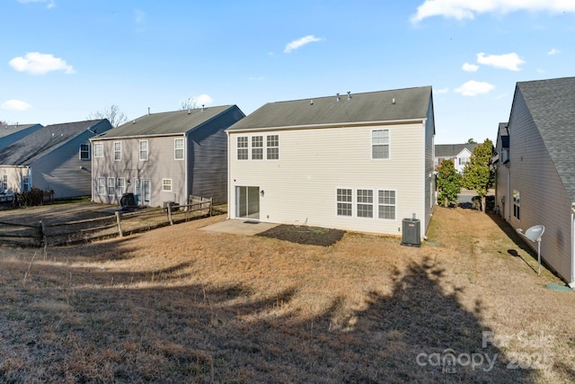 rear view of house featuring a lawn, a patio, a residential view, fence, and cooling unit