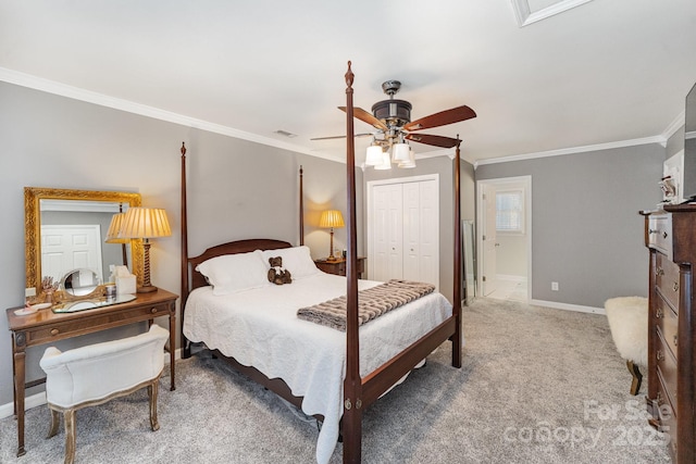 carpeted bedroom featuring baseboards, a closet, visible vents, and crown molding