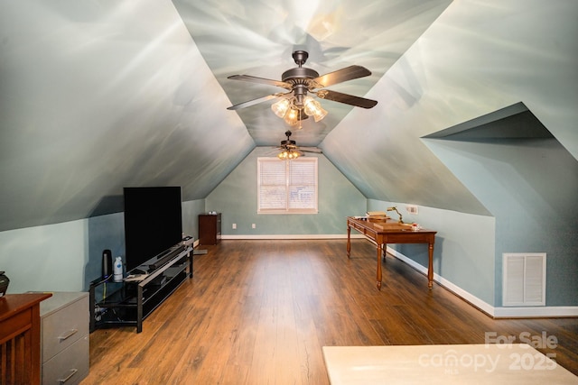 bonus room with lofted ceiling, baseboards, visible vents, and wood finished floors