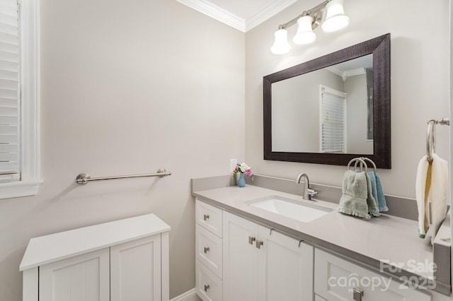 bathroom featuring ornamental molding and vanity