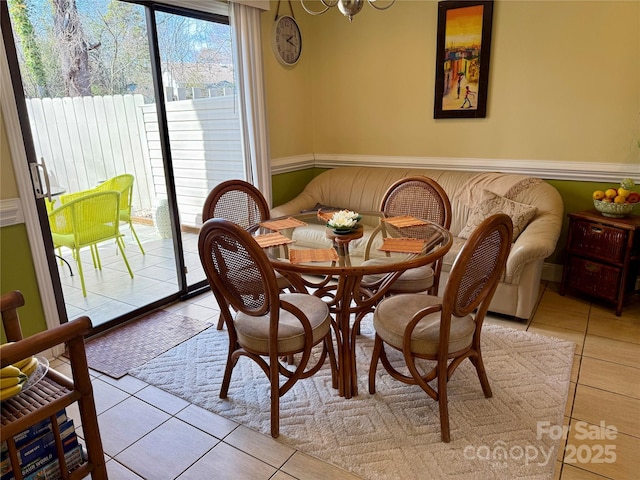 dining space featuring light tile patterned floors