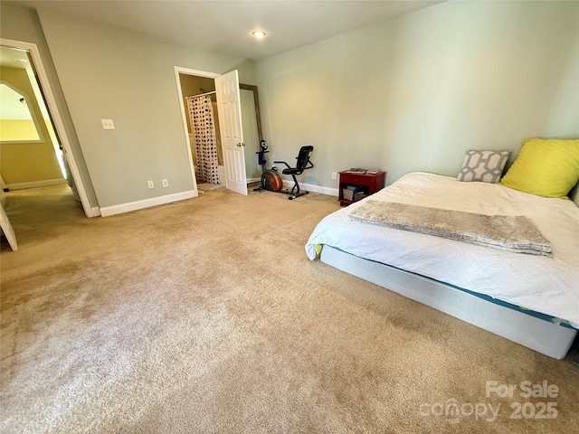 carpeted bedroom with baseboards