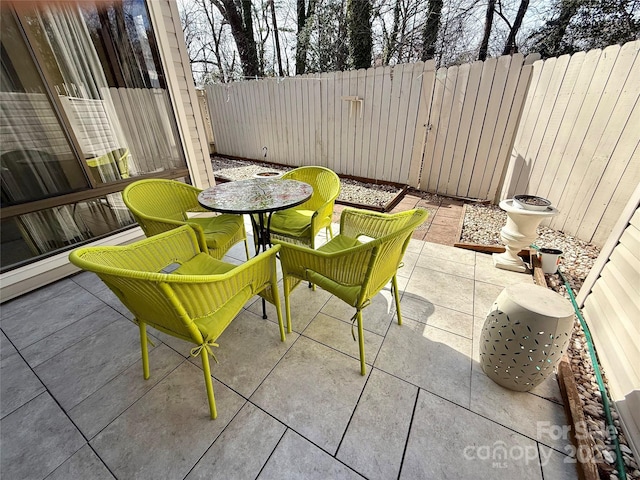 view of patio / terrace featuring outdoor dining space and a fenced backyard