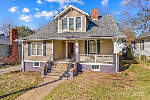 bungalow-style house with a front yard, covered porch, roof with shingles, and a chimney