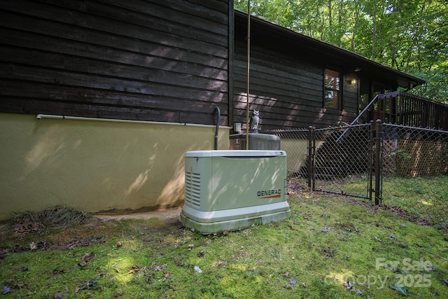 details featuring fence and a power unit