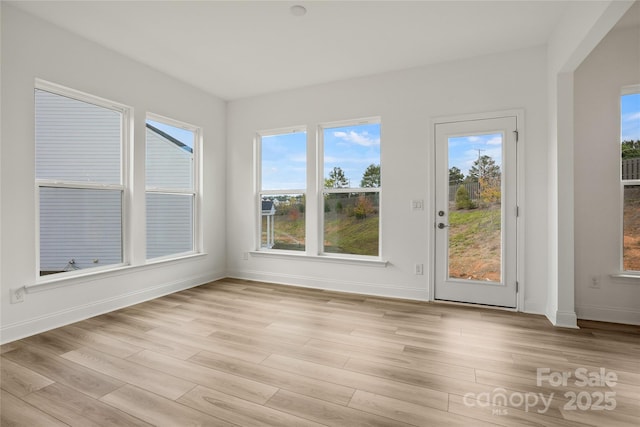 unfurnished sunroom featuring plenty of natural light