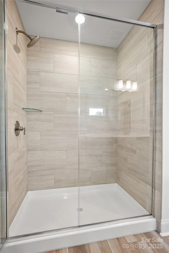 full bathroom with a shower stall