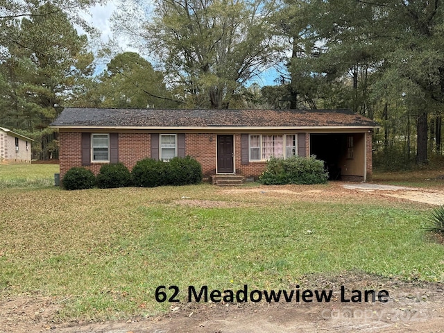 ranch-style home with a garage, a front lawn, and brick siding