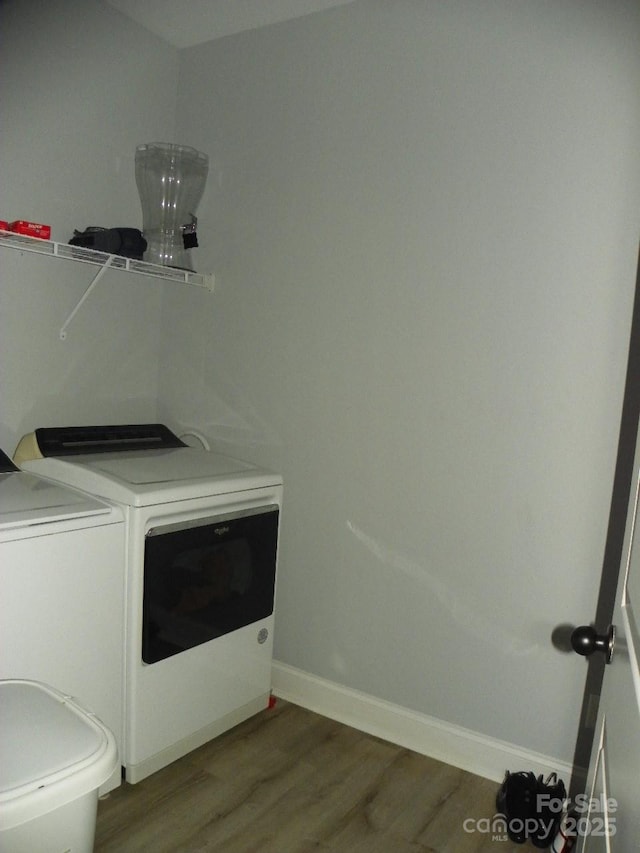 128 Summerlake Dr, New London, NC 28127 - clothes washing area featuring dark wood-style floors, laundry area, baseboards, and washing machine and clothes dryer
