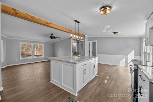 kitchen with electric range, open floor plan, dark wood-style flooring, and a center island