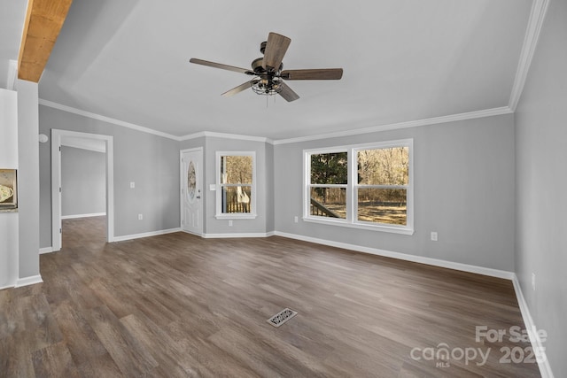 unfurnished living room with ornamental molding, wood finished floors, visible vents, and baseboards