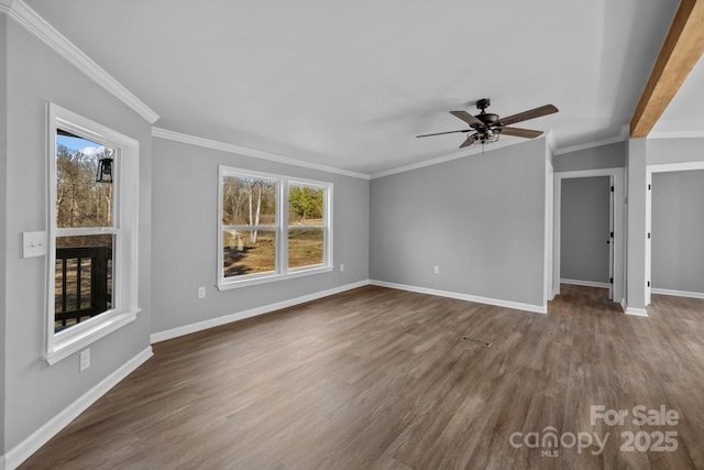 interior space with crown molding, plenty of natural light, dark wood finished floors, and baseboards