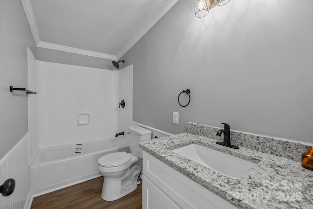 bathroom with toilet, wood finished floors, vanity, bathing tub / shower combination, and crown molding