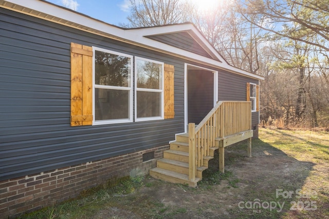 view of home's exterior with crawl space