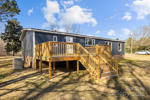 back of property with crawl space, stairs, a deck, and cooling unit