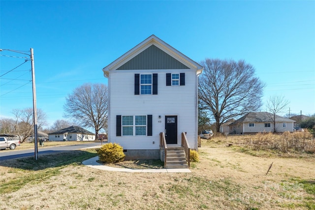 traditional home with crawl space and a front lawn