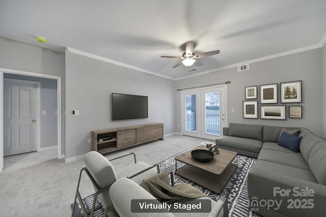 living room with light carpet, baseboards, visible vents, and ornamental molding