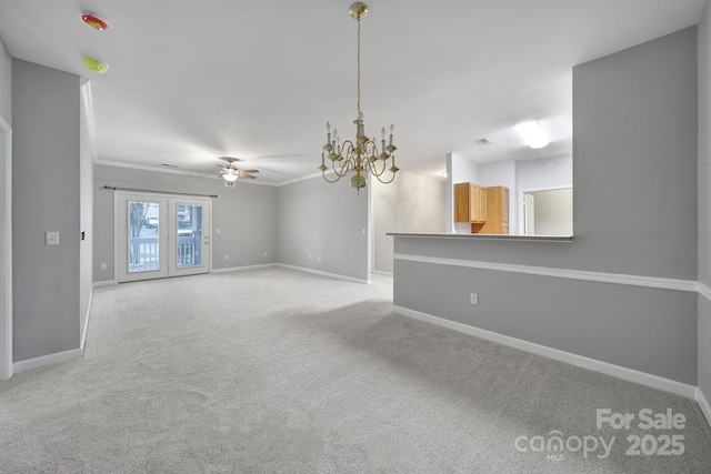 interior space featuring ornamental molding, light colored carpet, baseboards, and ceiling fan with notable chandelier