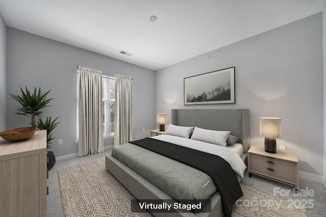 bedroom with light carpet, visible vents, and baseboards