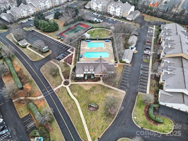 birds eye view of property with a residential view