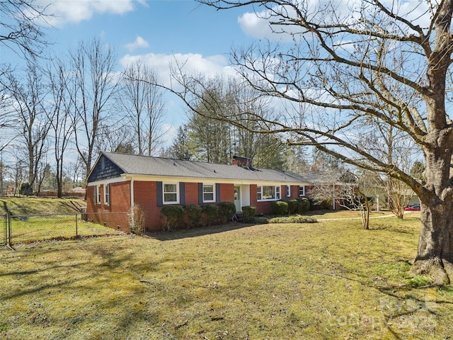 single story home featuring a front lawn, a chimney, fence, and brick siding