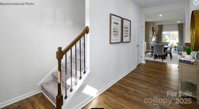 hallway with stairway, baseboards, dark wood finished floors, and recessed lighting