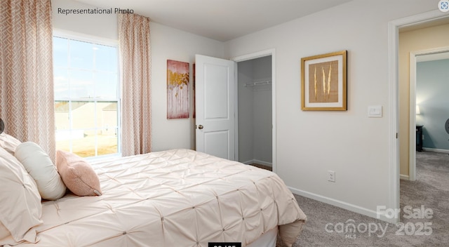 bedroom featuring a closet, carpet flooring, and baseboards